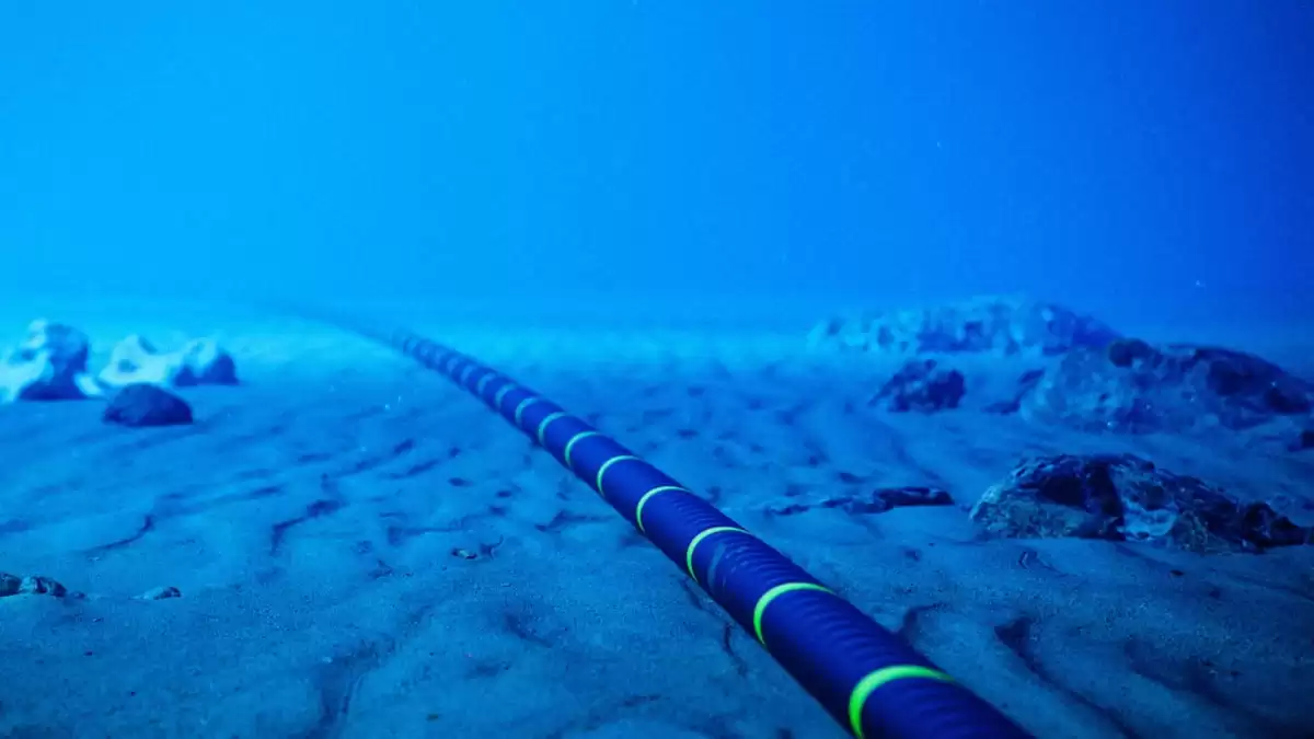 Underwater view of a subsea fiber-optic cable, representing Meta's $10 billion investment in global connectivity infrastructure.