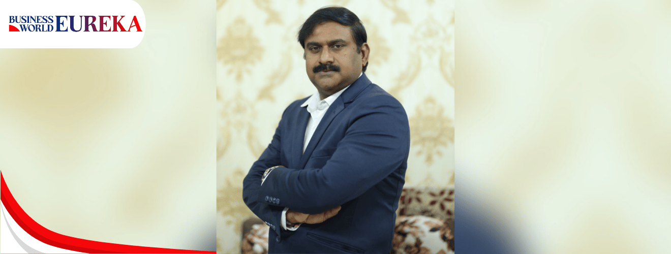 V.V. Subba Raju in a formal blue suit posing confidently with arms crossed, featured in Business World Eureka.